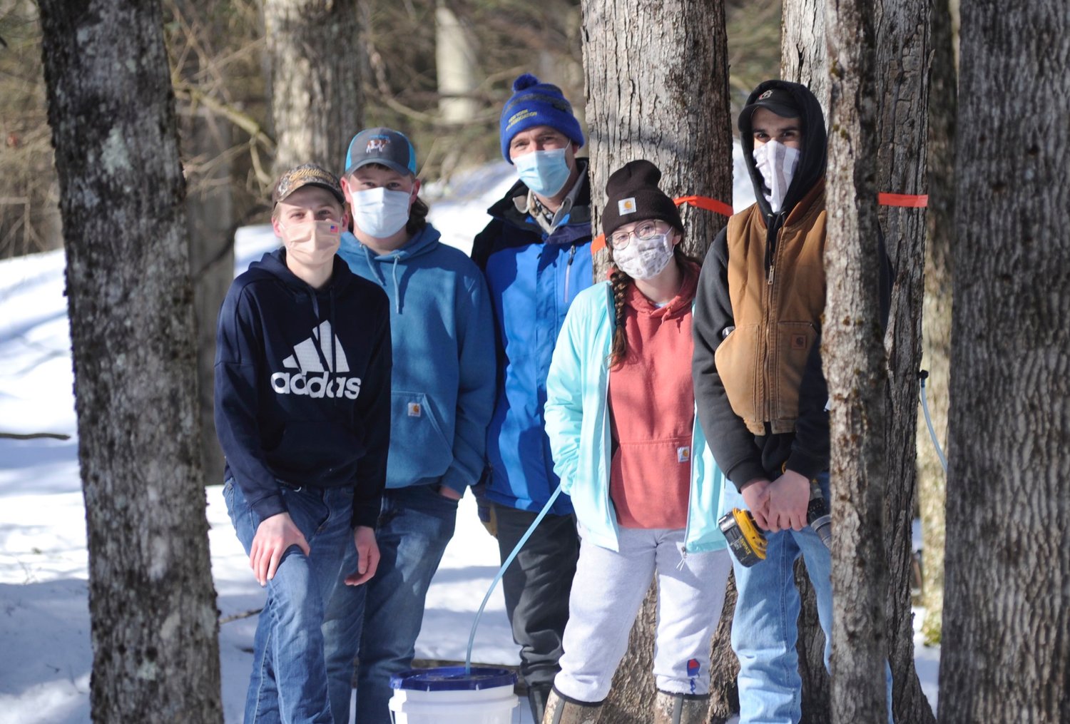 In search of syrup. Members of Sullivan West’s new Agriculture Club: Colin Kaveski, left, Colin Phelps, science/agriculture teacher Padraic “Paddy” McCarthy, Kayla Wilson and William Chellis.